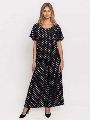 Spodnie z szerokimi nogawkami w białe grochy czarne 0184