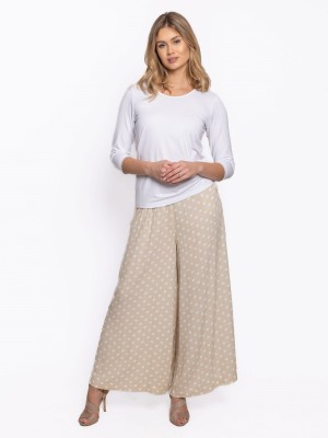 Spodnie z szerokimi nogawkami w białe grochy beż 0183